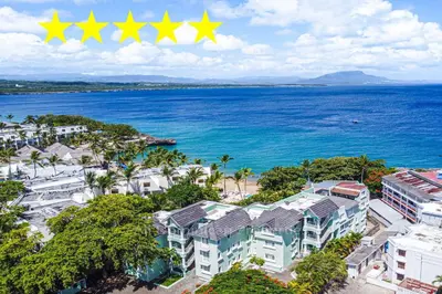 an aerial view of a resort with three stars at 