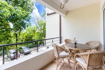 a balcony with a table and chairs and a view at 