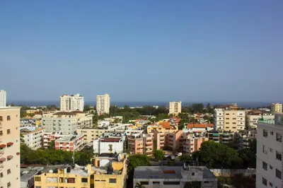 a view of a city with tall buildings at Modern and centric Apartment with pool and gym at Downtown in Santo Domingo