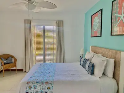 a bedroom with a large bed and a window at Stunning Beachfront Condo With Private Beach, Las Terrenas-El Limón in El Limón