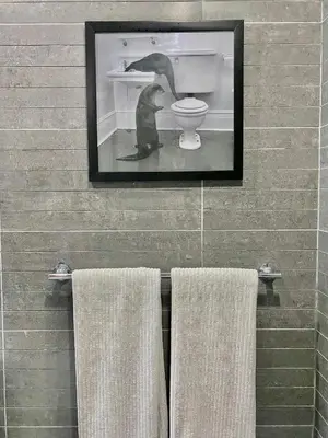 a picture of a cat in a bathroom with towels at Stunning Beachfront Condo With Private Beach, Las Terrenas-El Limón in El Limón