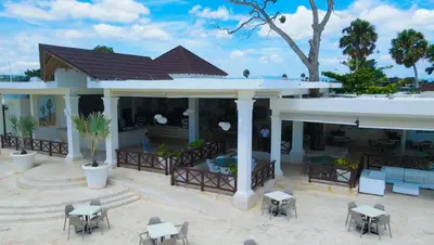 an aerial view of a house with tables and chairs at Sosua Ocean Village, Villa 9 Campo Del Mar , IV in Sosúa