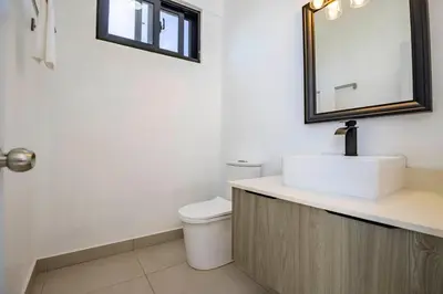 a bathroom with a sink and a mirror at Sosua Ocean Village, Villa 9 Campo Del Mar , IV in Sosúa
