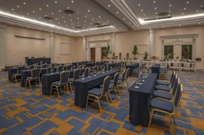 a banquet hall with tables and chairs in a room at Iberostar Waves Costa Dorada - All Inclusive in San Felipe de Puerto Plata