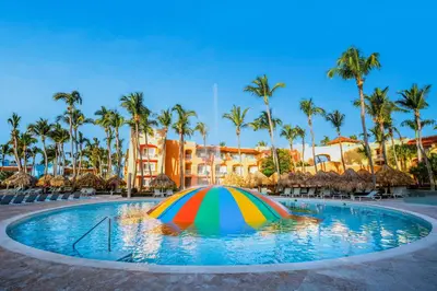 a colorful umbrella in the pool at a resort at Iberostar Selection Hacienda Dominicus - All Inclusive in Bayahibe