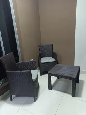 a room with two chairs and a table and a bench at Simply the most comfortable place next to Boca Chica beach in Boca Chica