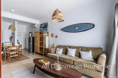 a living room with a couch and a table at Ocean Dream Studios, kiters paradise! in Cabarete