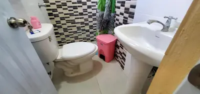 a bathroom with a toilet and a sink at HOTEL RANCHO EL NOVATO in Concepción de La Vega