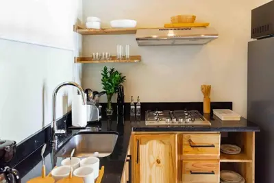 a kitchen with a sink and a stove at Hacienda La Huerta, Puerto Plata in San Felipe de Puerto Plata