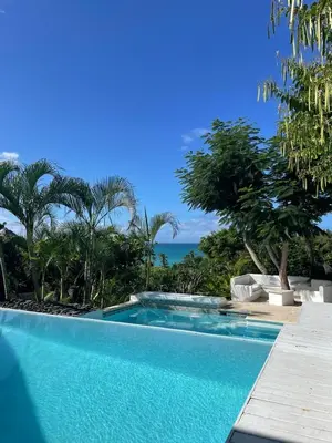 a swimming pool with a view of the ocean at ITAKA LOMA BONITA in Las Terrenas