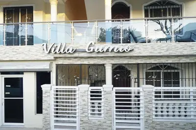 a building with a sign that reads villa grilles at Villa Gumio Studio Apt - 7 minutes walk to Boca Chica Beach apts in Boca Chica