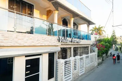 a building with a sign that reads wild sauce at Villa Gumio 2BR Apt -7min walk Boca Chica Beach apts in Boca Chica