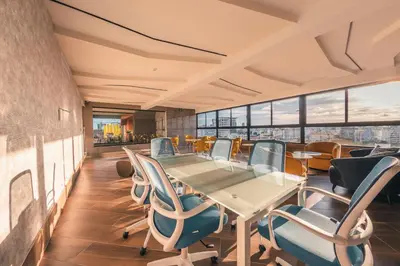 a conference room with a table and chairs at Breakfast Included at Regatta Living 605 in Los Prados