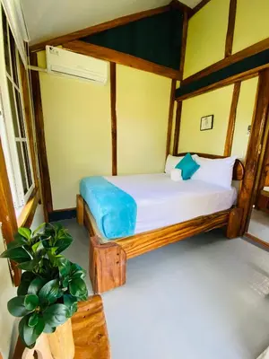 a bedroom with a bed in a room at Baby Rustic in Punta Rucia