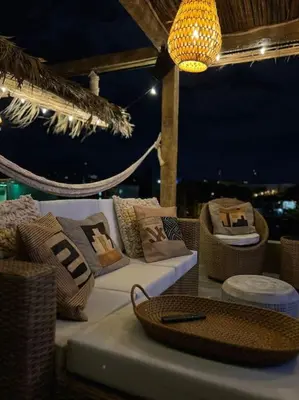 a living room with a couch and a chandelier at Lux Ph & Rooftop Terrace to Relax in Santiago de los Caballeros