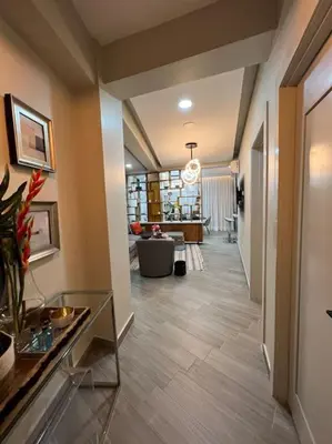 a hallway of a home with a living room at Lux Ph & Rooftop Terrace to Relax in Santiago de los Caballeros