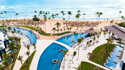 an aerial view of the beach and pool at a resort at Secrets Tides Punta Cana - All Inclusive in Punta Cana