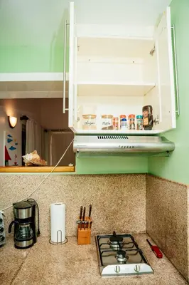 a kitchen counter with a stove top in a kitchen at Apartamento Los Anturios en Puerto Plata Bayardo in San Felipe de Puerto Plata