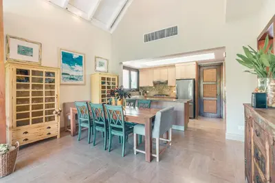 a kitchen and dining room with a table and chairs at Nearby beach and beach club at Portillo NF in Las Terrenas