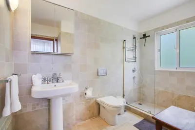 a bathroom with a sink and a toilet and a shower at Stunning 3-Bedroom Villa with Pool, Jacuzzi and Maid near Bavaro Beach in Punta Cana