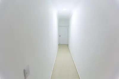 an empty hallway with white walls and a floor at MB Apartment - A in San Felipe de Puerto Plata
