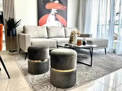 a living room with a couch and a table at VIP DELUXE AND TOWER J7_POOL_GYM_SAUNE_WIFE in Santo Domingo
