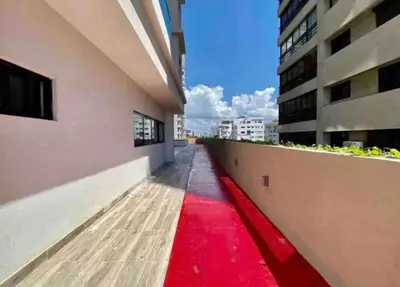 a red carpet on the side of a building at VIP DELUXE AND TOWER J7_POOL_GYM_SAUNE_WIFE in Santo Domingo