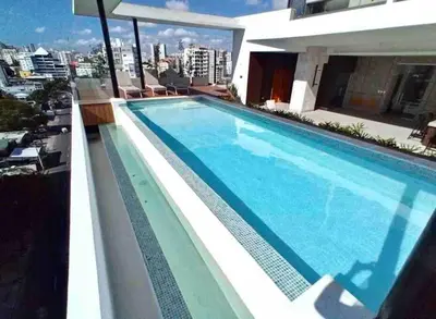 a swimming pool on the roof of a building at Luxury 1 BDR , Rooftop POOL, Gym, in Downtown D2 in Santo Domingo