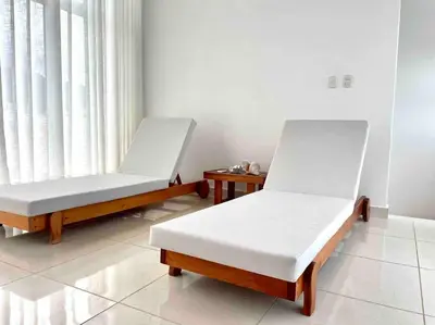 two beds sitting in a room with a window at LUXURY_VIP_Villa_LifeStyle puerto plata in San Felipe de Puerto Plata
