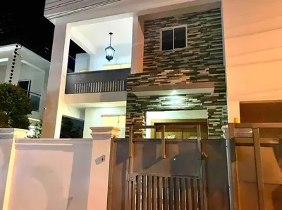 a house with a brick fireplace and a wooden gate at LUXURY_VIP_Villa_LifeStyle puerto plata in San Felipe de Puerto Plata