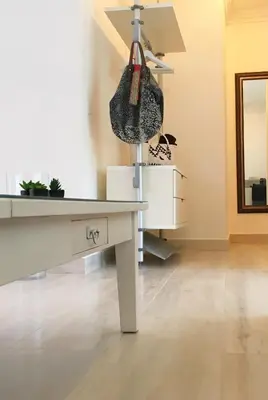 a white desk with a purse hanging on a wall at Casa Veintiuno in Sosúa
