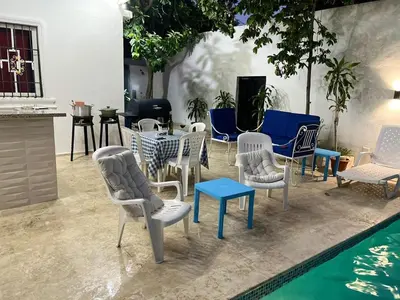 a group of chairs and tables next to a pool at R.G sol 2 in Pantoja