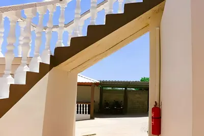 a stairway leading up to a house with white walls at Apart hotel Costa Verde Exclusivo y Seguro #5 con cama Queen in Las Galeras