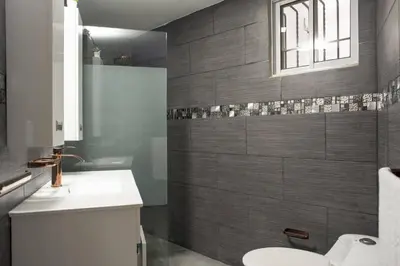 a bathroom with a sink and a toilet at 8BR Penthouse Jacuzzi, Pool Table Terrace in Los Prados