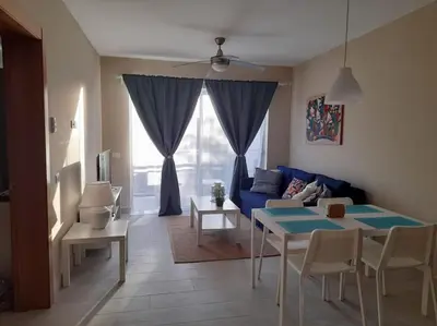 a living room with a blue couch and a table at Casa Larimar 214 - Vibe Residence in La Laguna