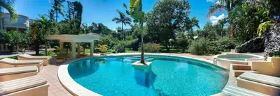 a swimming pool in the middle of a resort at Villa La Plantacion in Las Galeras