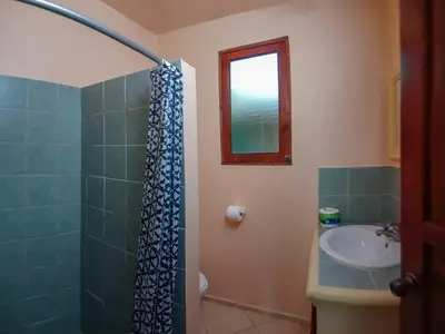 a bathroom with a shower and a sink at Villa La Plantacion in Las Galeras
