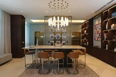 a dining room with a table and chairs at Courtyard by Marriott Santo Domingo Piantini in Santo Domingo