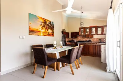 a kitchen and dining room with a table and chairs at Novus Mare, Cabarete center! in Cabarete