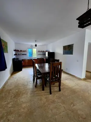 a dining room with a table and chairs in a room at Bella Villa Roomy apartment at 5 min walk to the beach in Las Galeras
