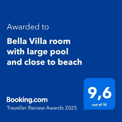 a screenshot of a cell phone with the text awarded to bellia villa room at Bella Villa Roomy apartment at 5 min walk to the beach in Las Galeras