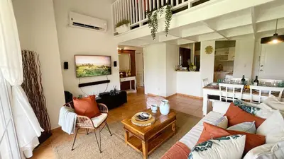 a living room with a couch and a table at Cozy apartment Golf Course View in Punta Cana in Punta Cana