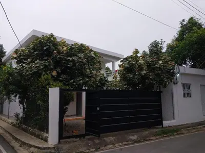 a black fence in front of a house at Apartamentos felix Las terrenas in Las Terrenas
