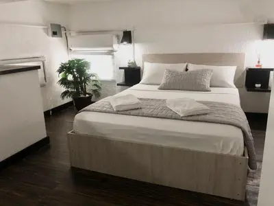 a bedroom with a large bed in a room at MOKA HOUSE in Santo Domingo