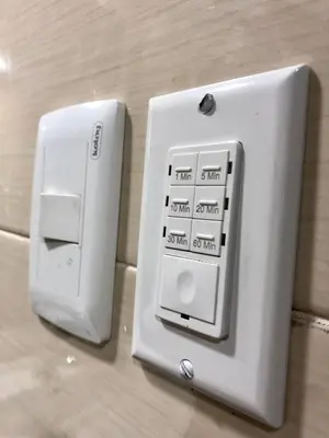 a white electrical switch on a wall at MOKA HOUSE in Santo Domingo