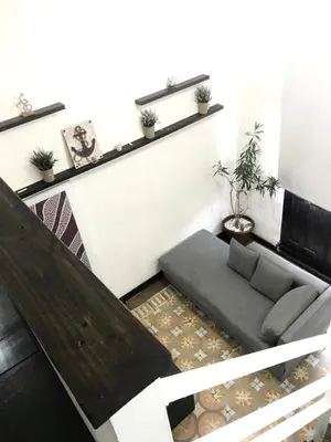 a living room with a couch and a table at MOKA HOUSE in Santo Domingo