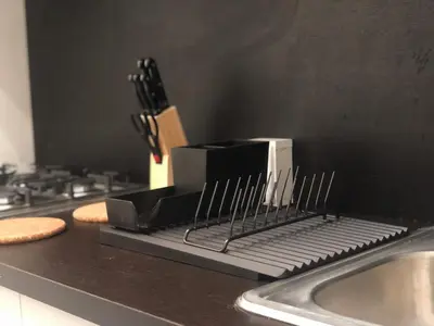 a kitchen counter with a knife rack next to a sink at MOKA HOUSE in Santo Domingo