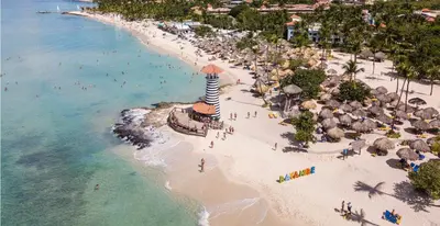 an aerial view of a beach with a lighthouse at Tamarindo Dominicus by Mireya in La Laguna