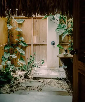 a room with a wooden fence and a door with plants at Buena Vida Macao 7 habitaciones in Salado