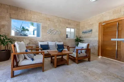 a living room with chairs and a table at Arena Village | 2H Retiro con Vista a Piscina in Punta Cana